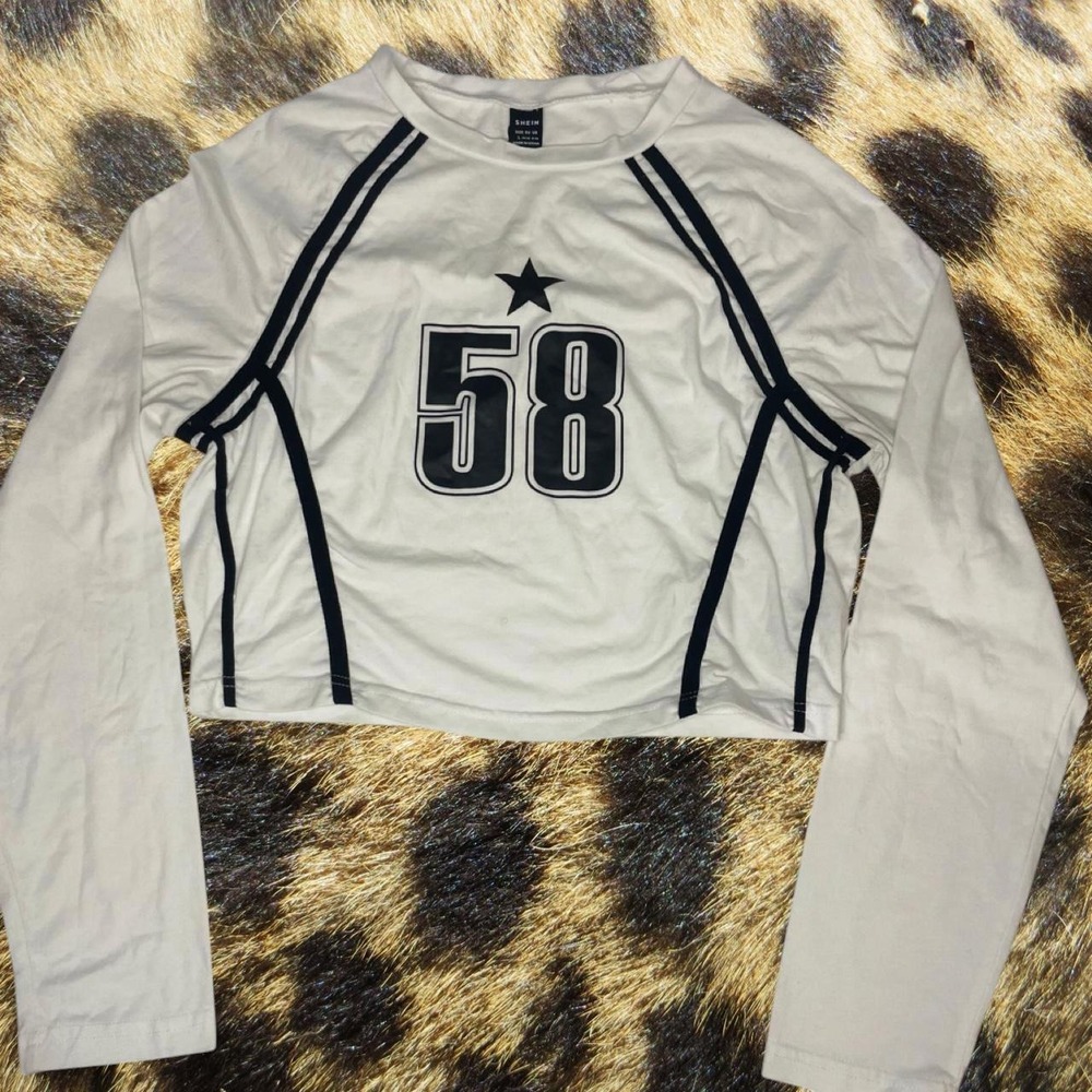 SHEIN white long sleeve sports top with black sports jersey graphic